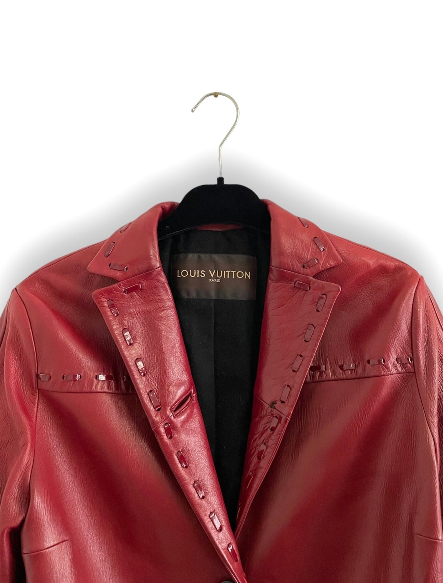 Manteau Louis Vuitton taille 40 en cuir bordeaux.