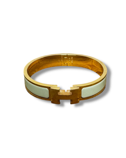 Bracelet Hermès Clic H doré et vert d'eau