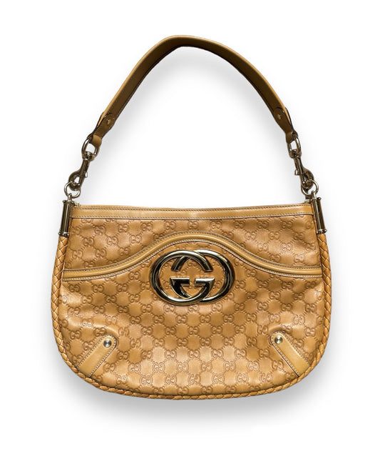 Sac Gucci vintage en cuir camel détail GG doré.